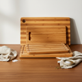 Bamboo Cutting Board Set of 3 sizes on a warm wooden surface